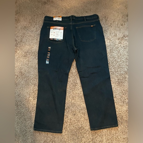 NEW MENS TIMBERLAND PRO JEANS
GRIT-N-GRIND
Dark Wash 
NWT 
Size 42 x 30 - Picture 2 of 3